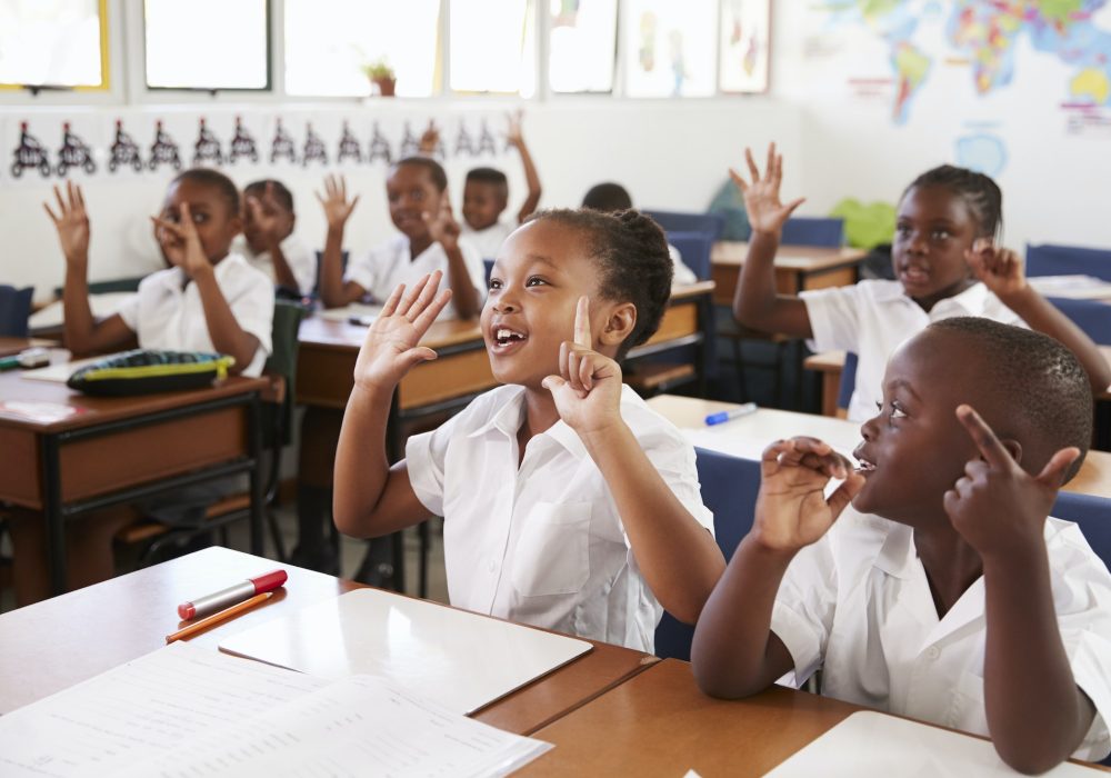 kids-showing-hands-during-a-lesson-at-an-elementary-school.jpg